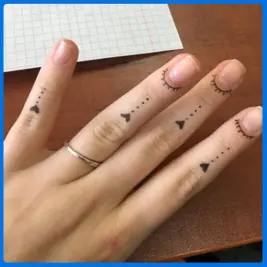 arrow tattoo in finger
