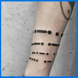 bigger code tattoo in arm