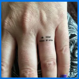code tattoo in ring finger