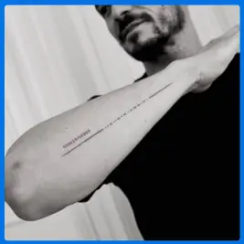 long code tattoo in arm