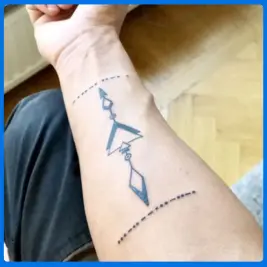 large morse code tattoo in arm