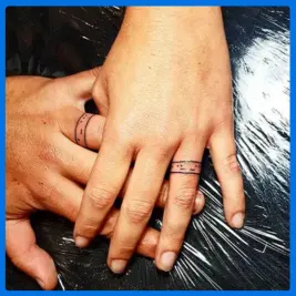 code ring shaped tattoo in finger